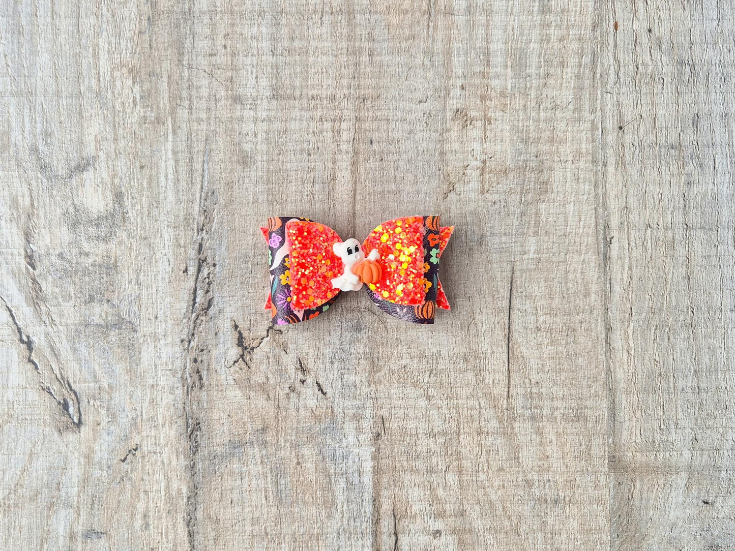 Orange Halloween Hair bow with a Cute Ghost and Glitter fabric .