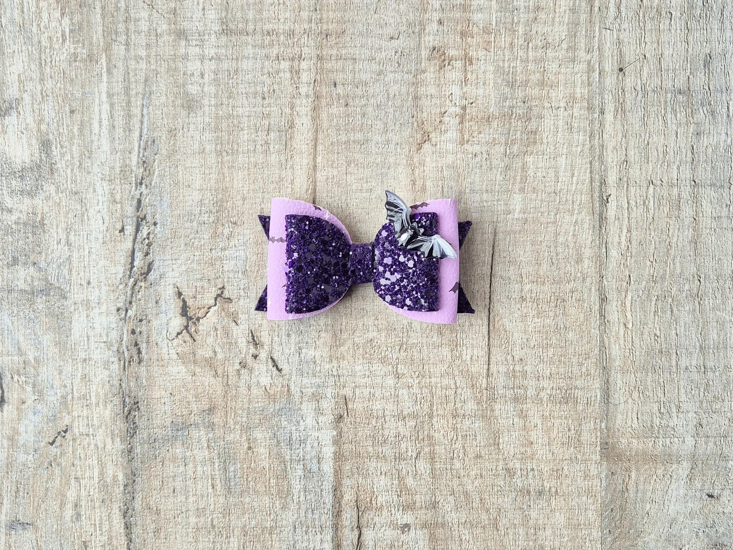 Halloween Hair bow in a purple glitter bat design.