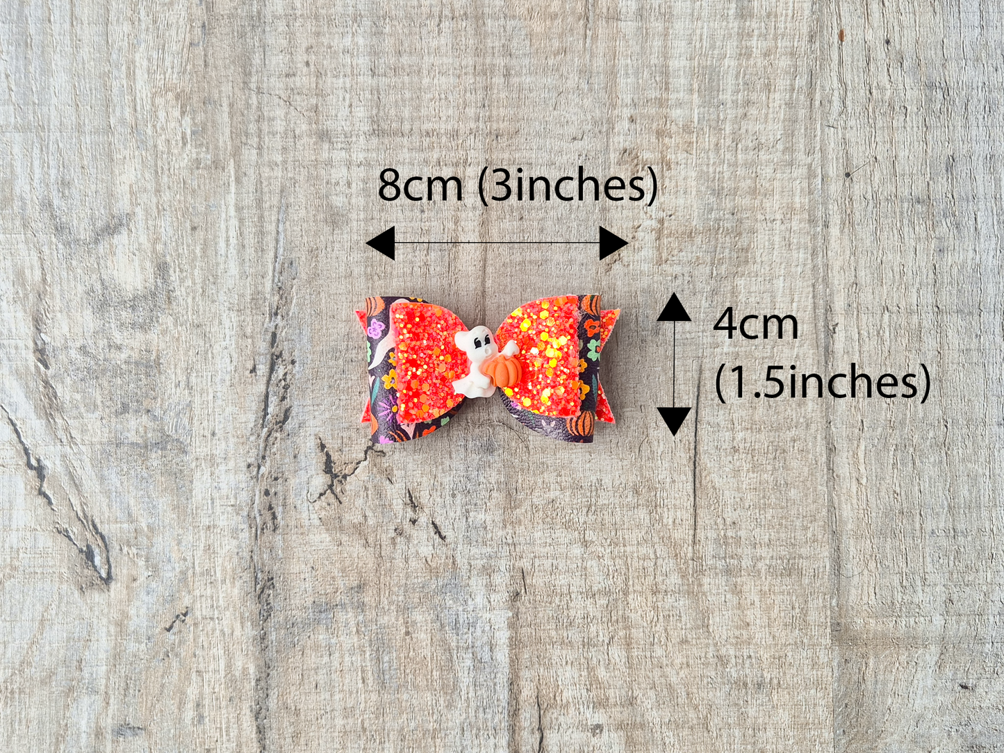 Orange Halloween Hair bow with a Cute Ghost and Glitter fabric .