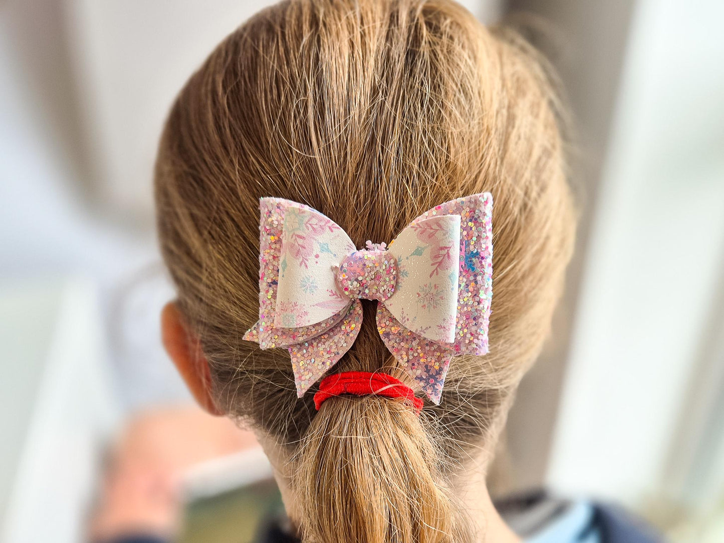 Pink Christmas Glitter Hair Bow in a Snowflake Design For Toddler or Girl.