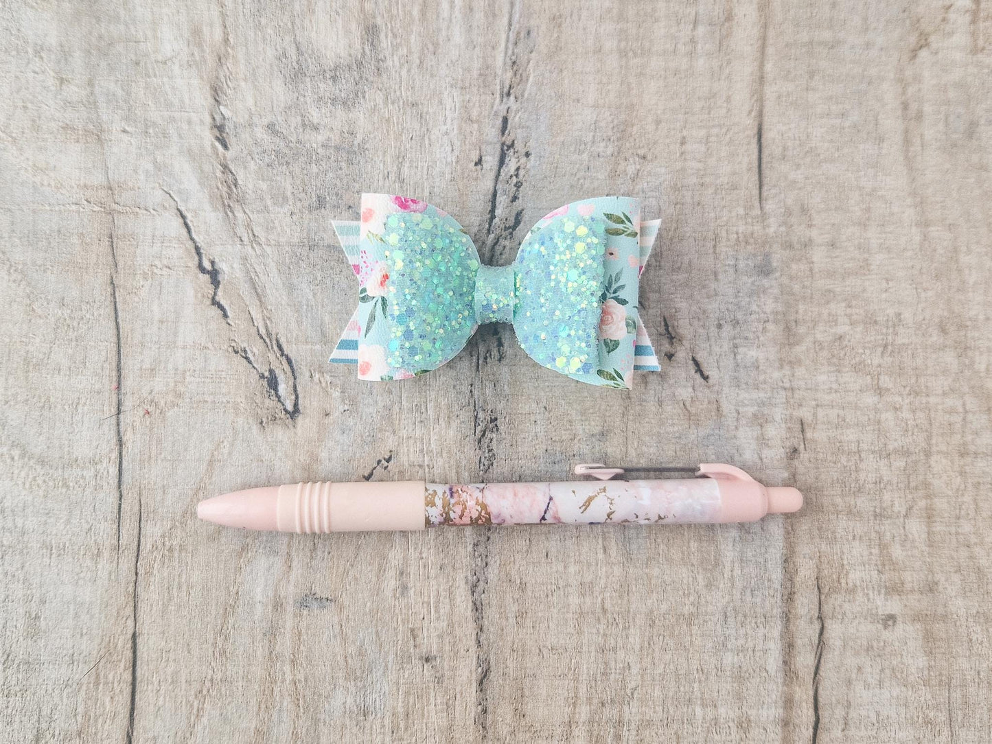 Pastel Green Spring Hair bow with a Floral design and Glitter.