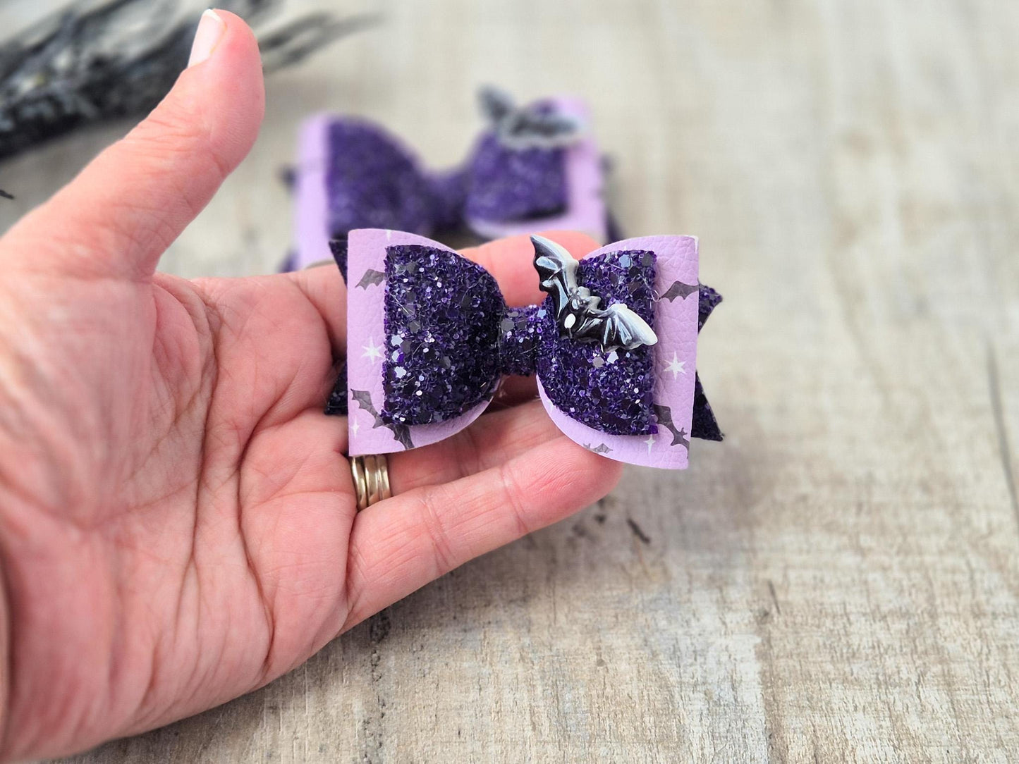 Halloween Hair bow in a purple glitter bat design.
