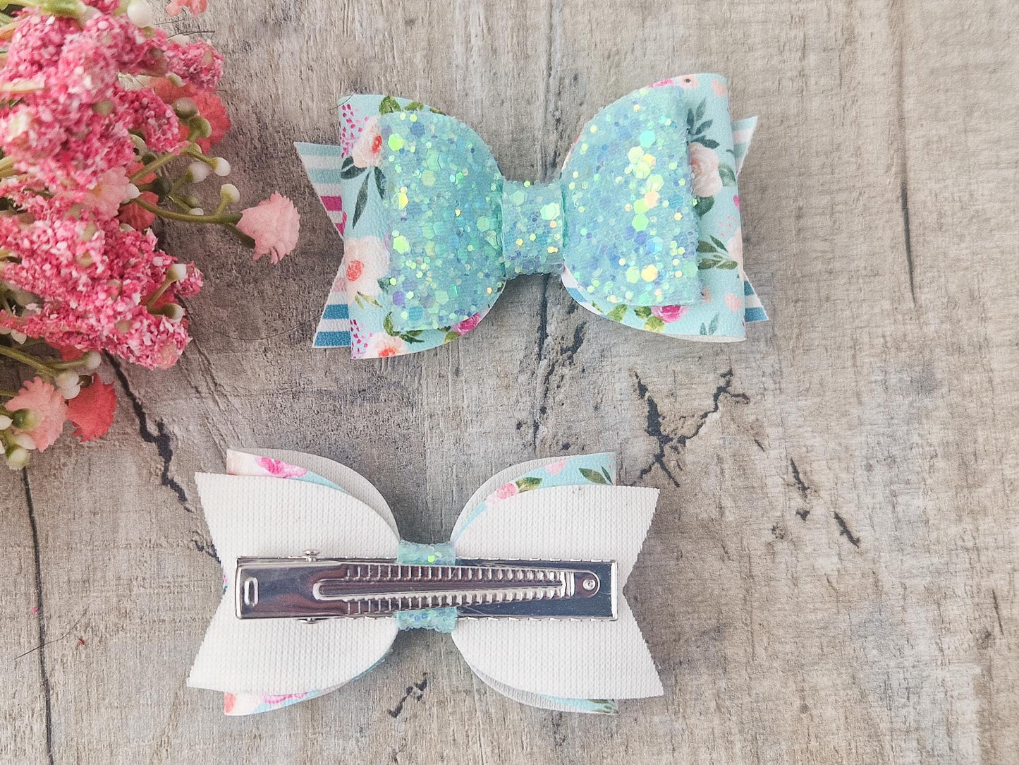 Pastel Green Spring Hair bow with a Floral design and Glitter.
