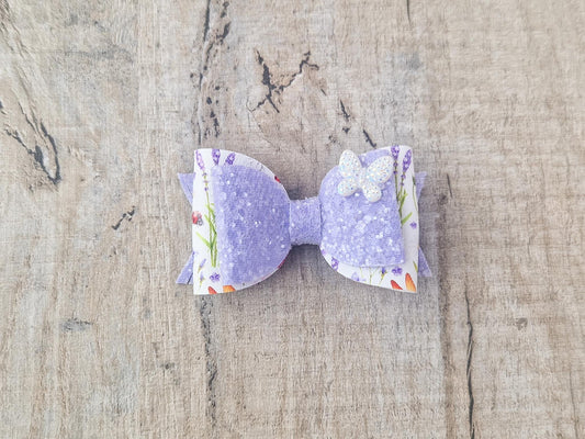 Purple Glitter Hair Bow with Butterfly embellishment and floral design.