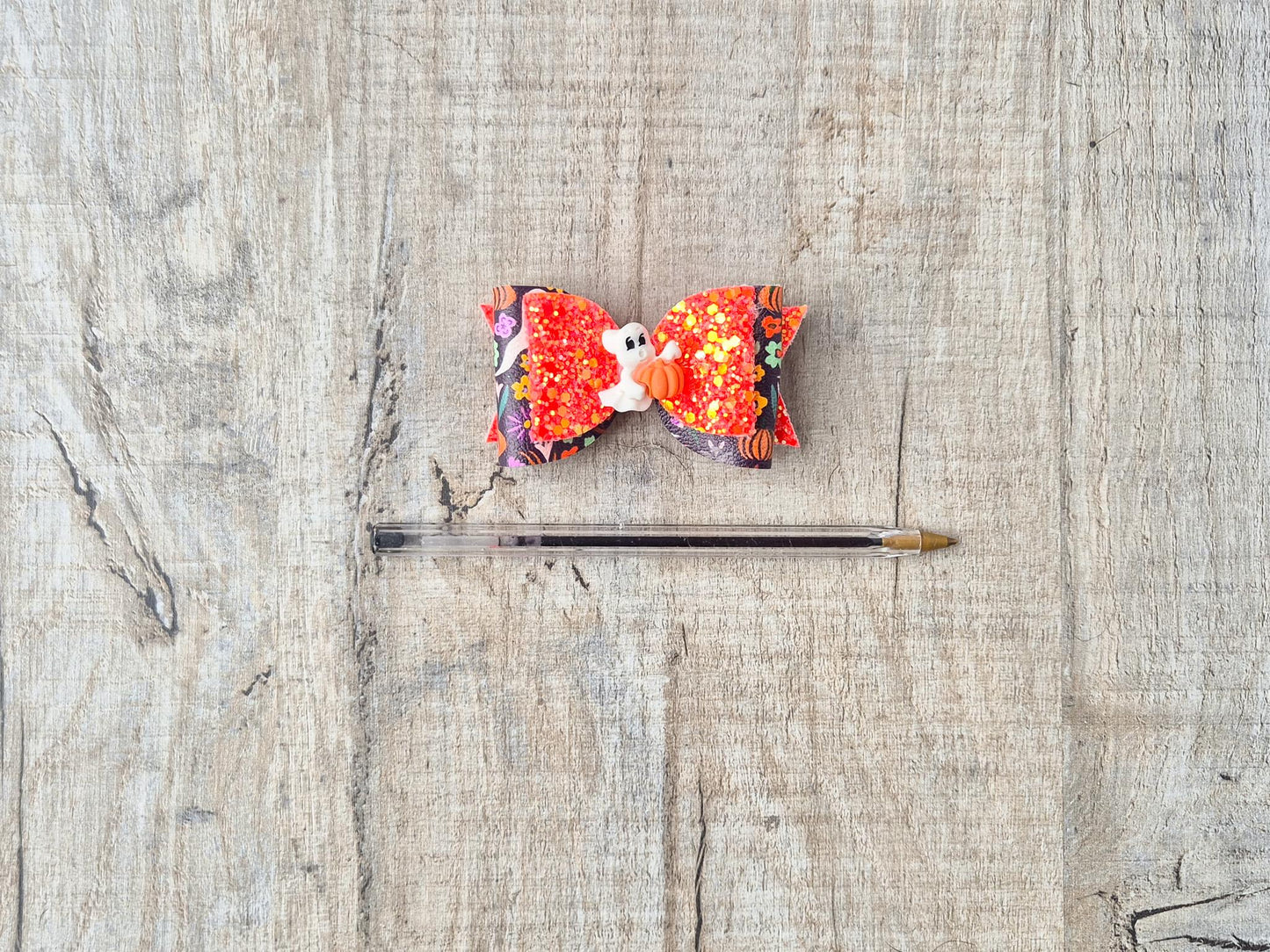 Orange Halloween Hair bow with a Cute Ghost and Glitter fabric .