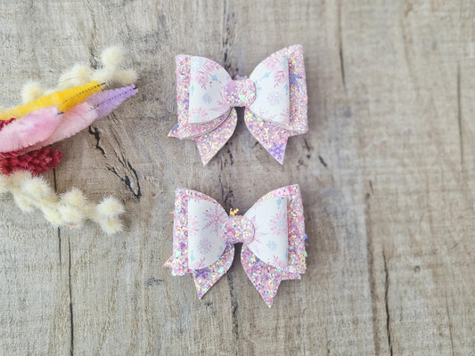 Pink Christmas Glitter Hair Bow in a Snowflake Design For Toddler or Girl.