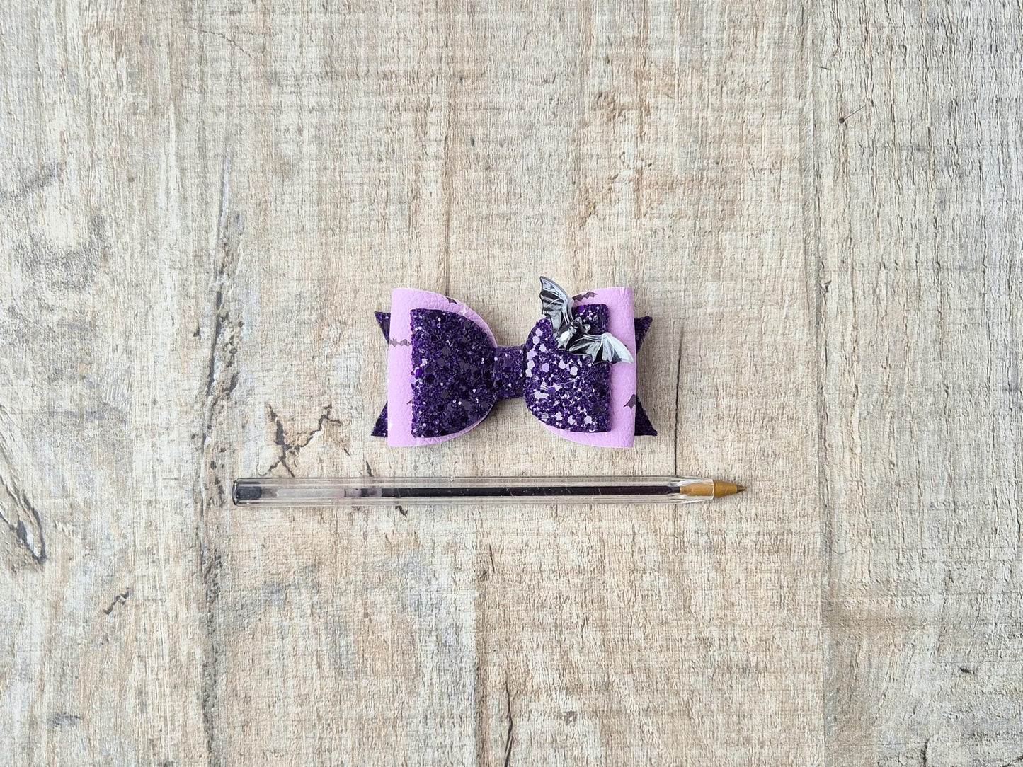 Halloween Hair bow in a purple glitter bat design.