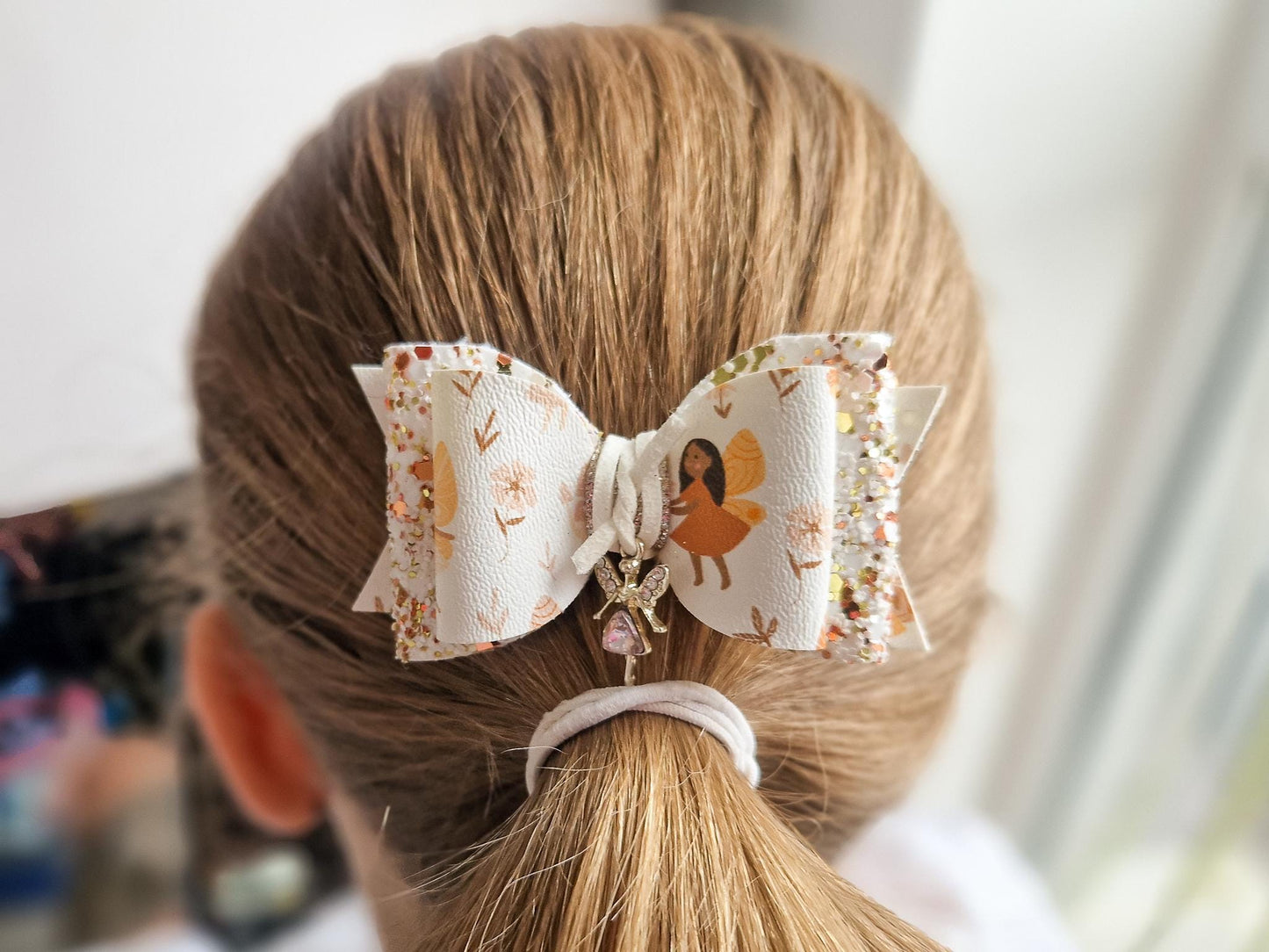 Autumn Fairy Hair Bow, finished with a Cute Fairy Charm.