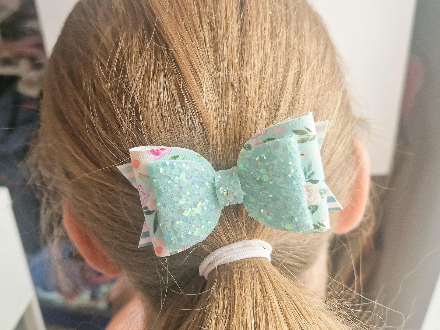 Pastel Green Spring Hair bow with a Floral design and Glitter.