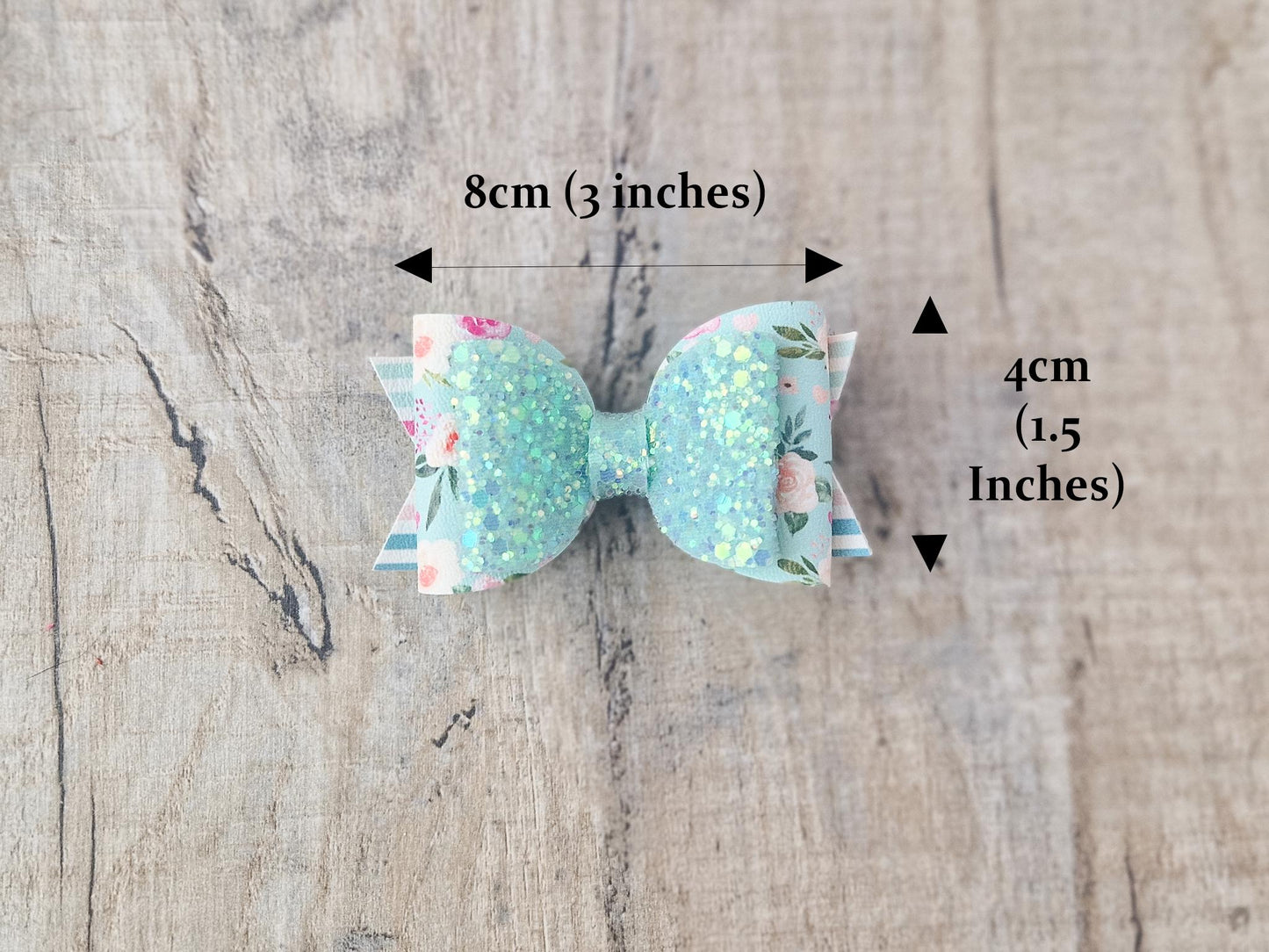Pastel Green Spring Hair bow with a Floral design and Glitter.