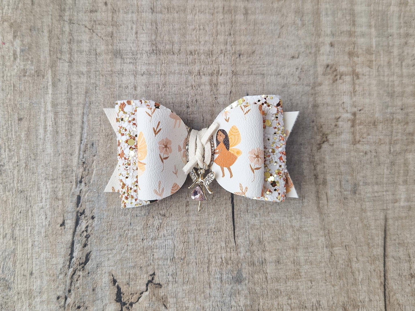 Autumn Fairy Hair Bow, finished with a Cute Fairy Charm.