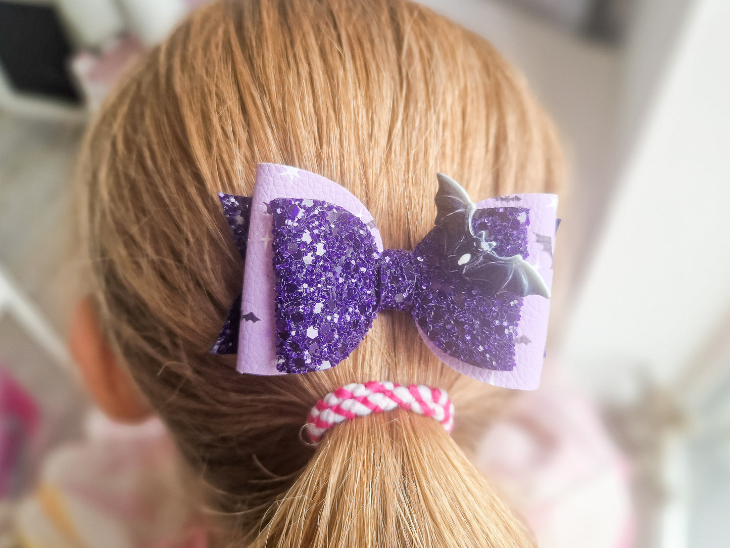 Halloween Hair bow in a purple glitter bat design.