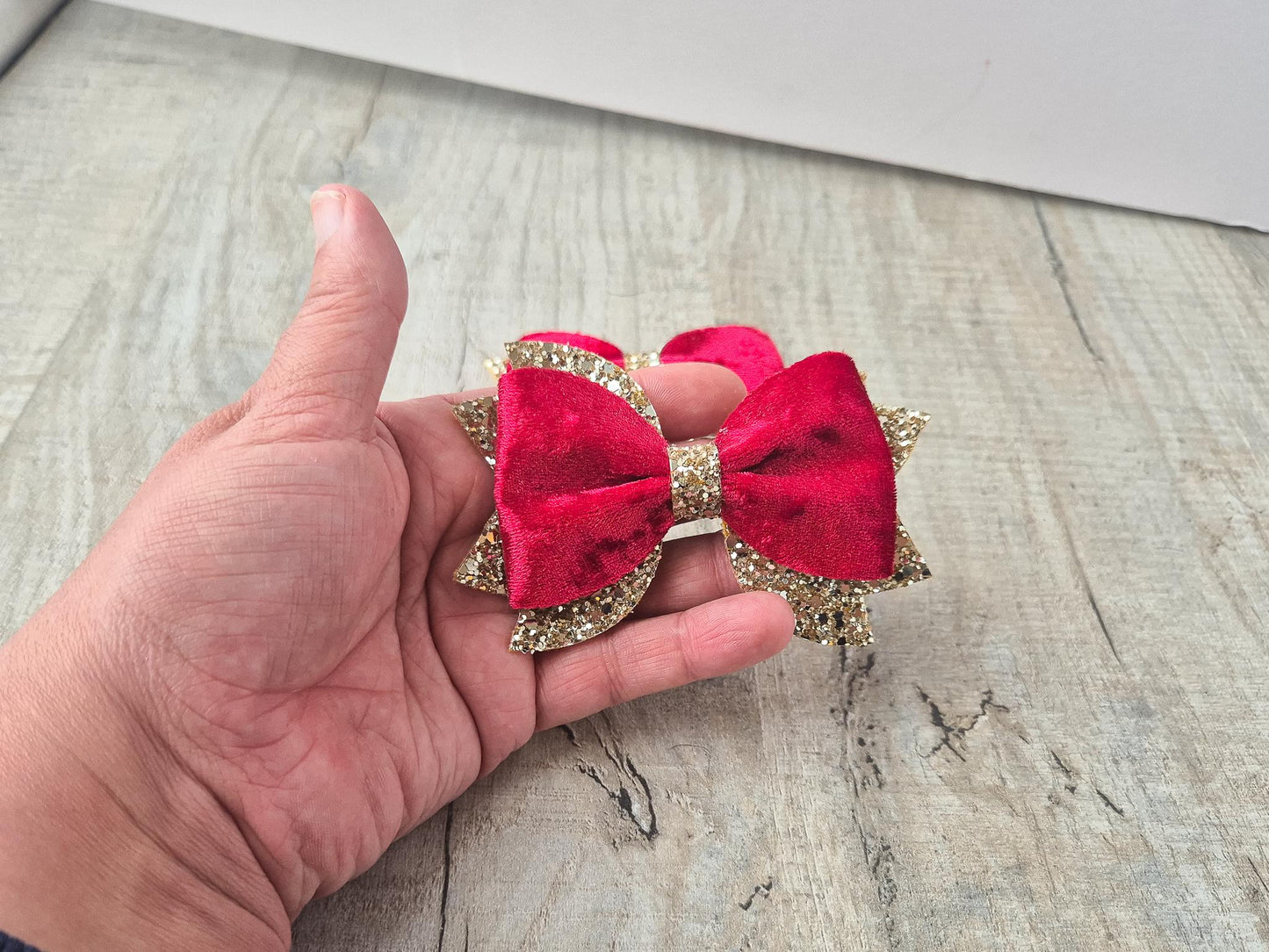 Red Christmas Hair bow for Girls made with Red velvet and gold glitter, the perfect accessory for older girls upwards