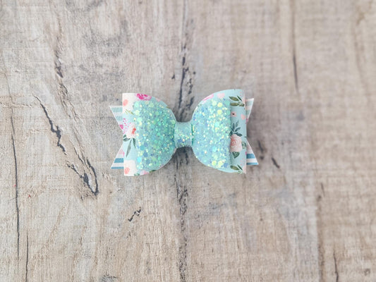 Pastel Green Spring Hair bow with a Floral design and Glitter.