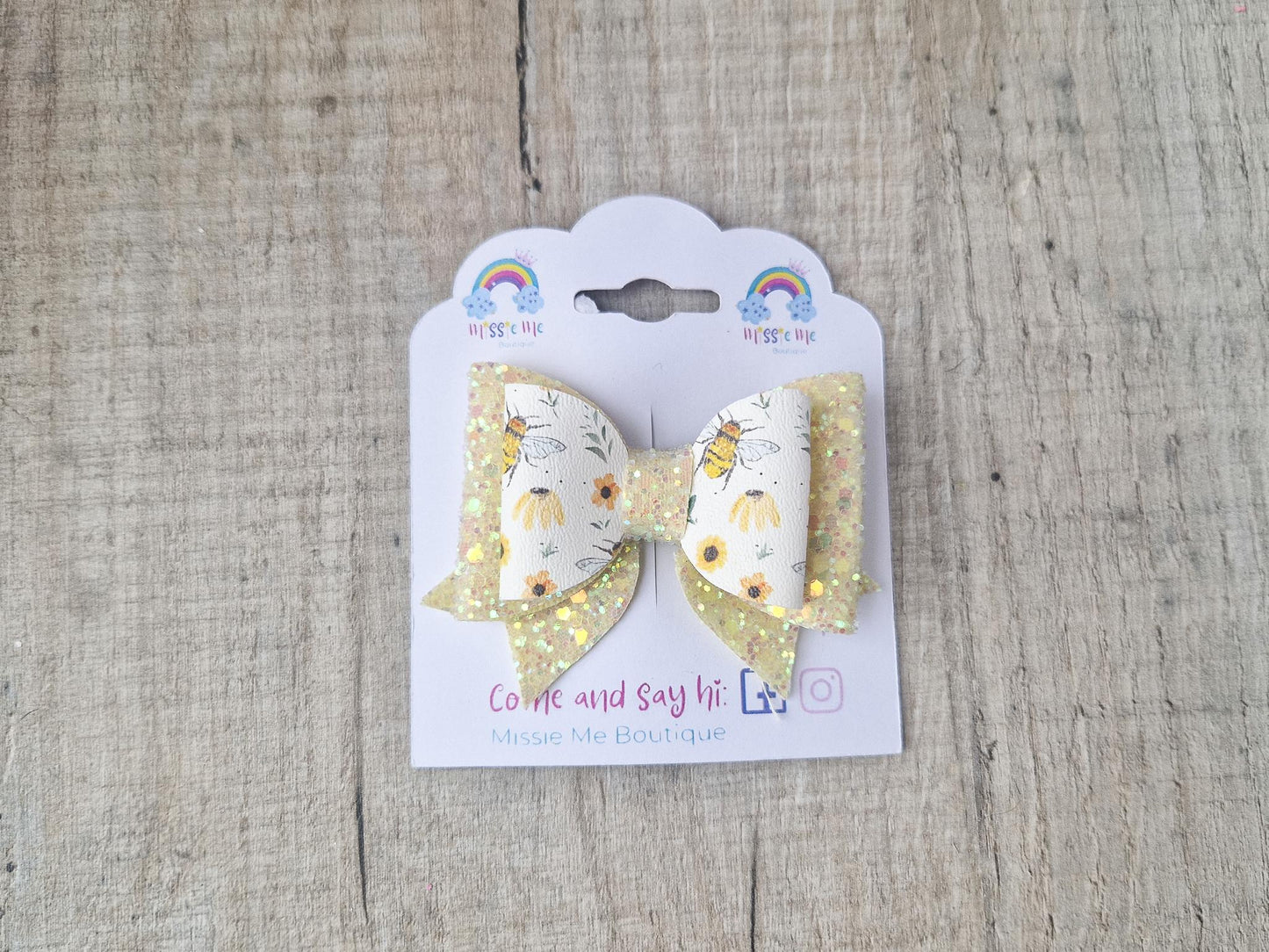Bee Hair bow with Yellow Glitter on a Hair clip. Small bow suitable for toddler upwards.