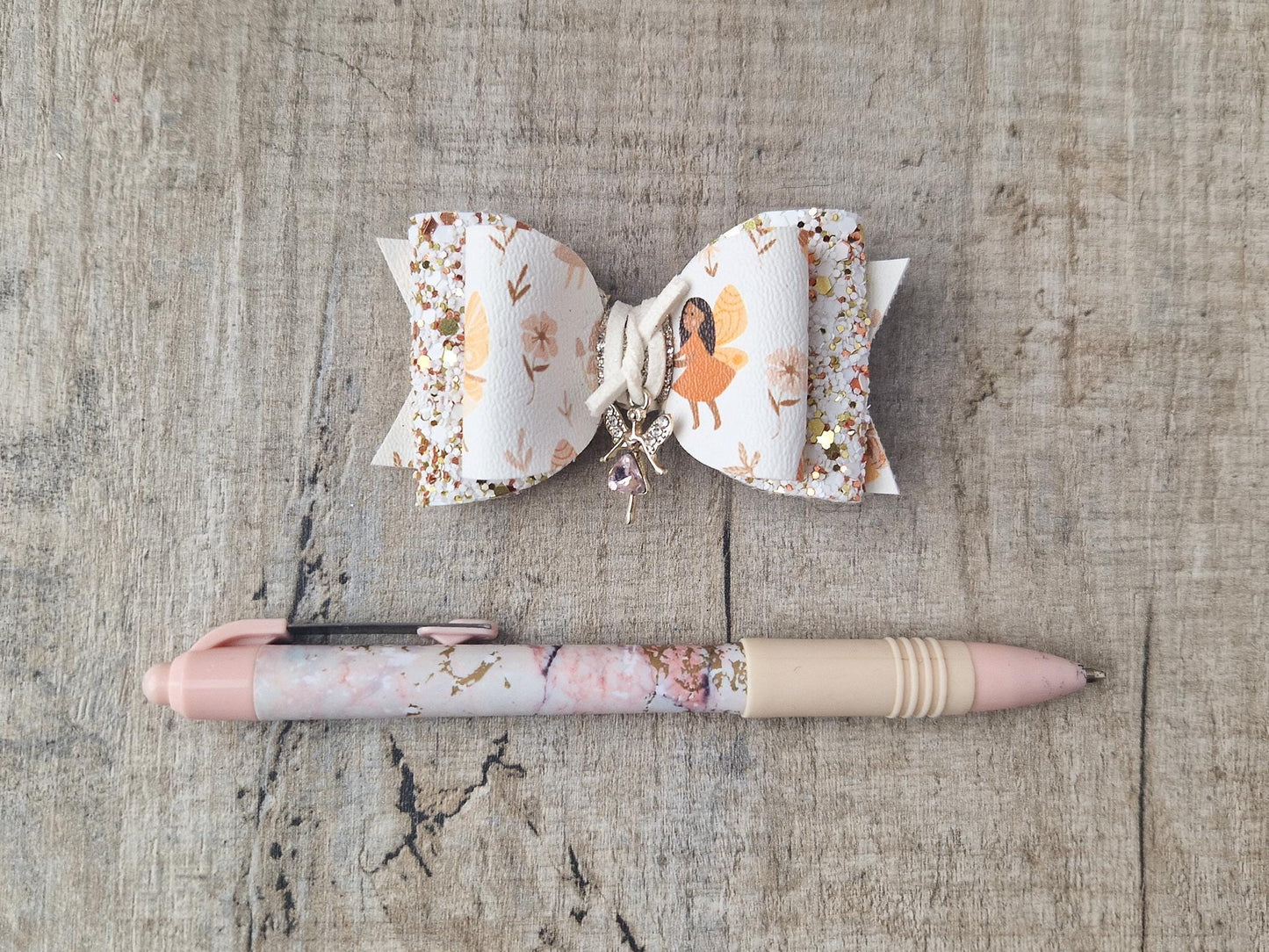 Autumn Fairy Hair Bow, finished with a Cute Fairy Charm.