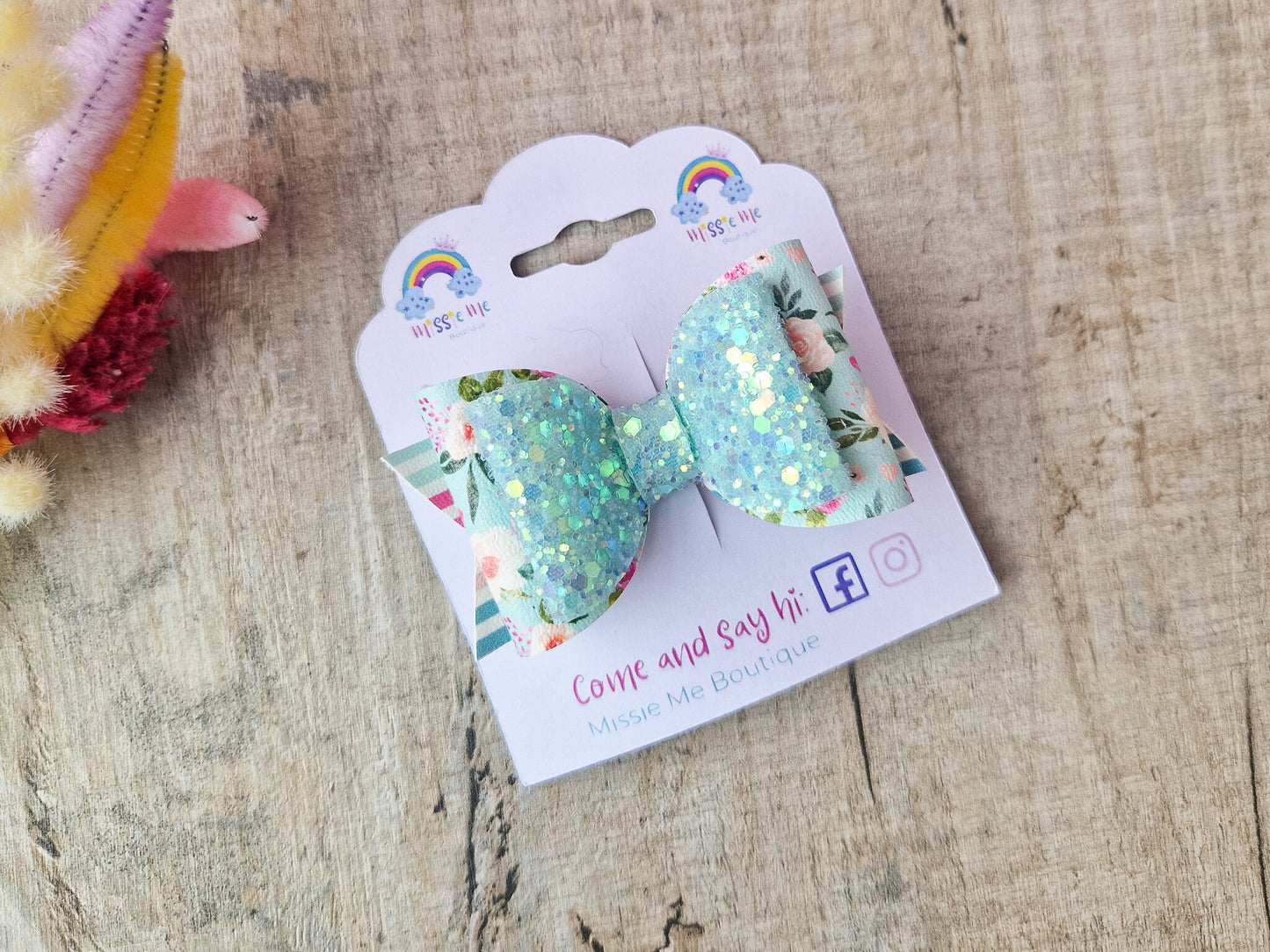 Pastel Green Spring Hair bow with a Floral design and Glitter.