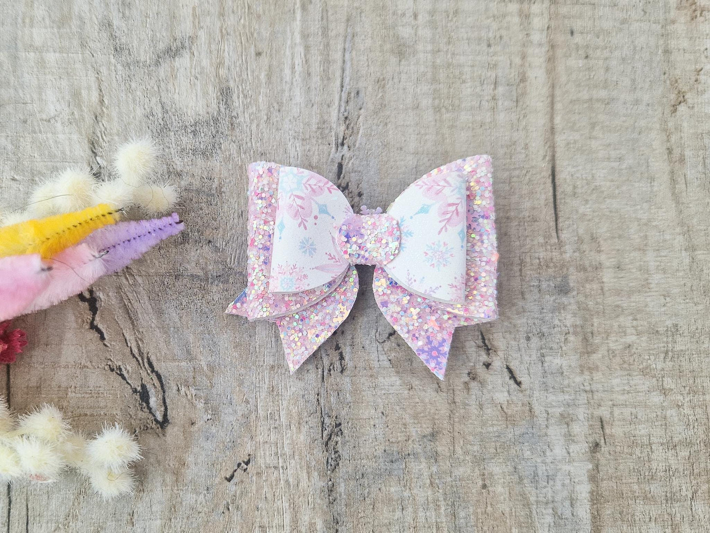 Pink Christmas Glitter Hair Bow in a Snowflake Design For Toddler or Girl.