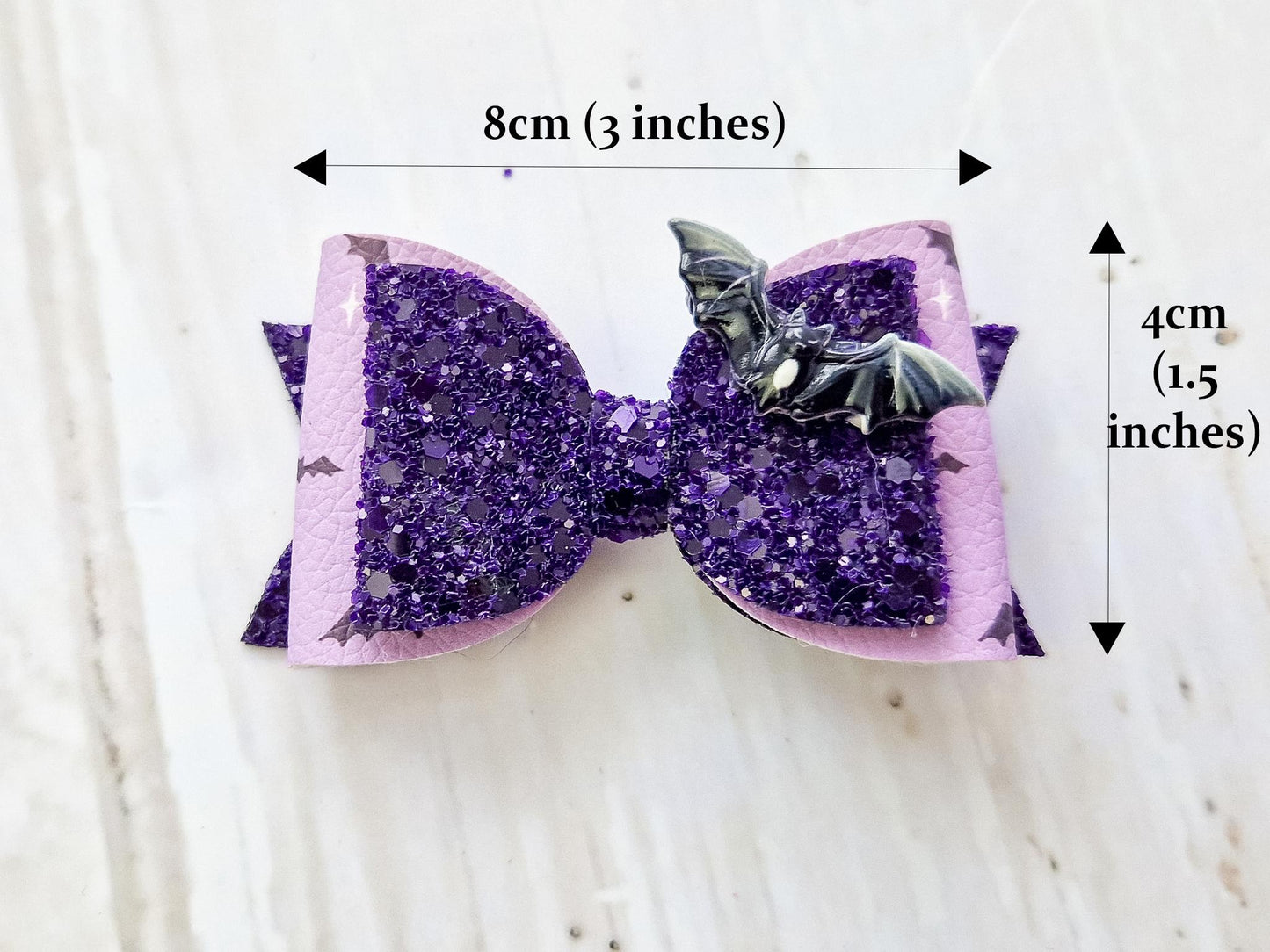 Halloween Hair bow in a purple glitter bat design.