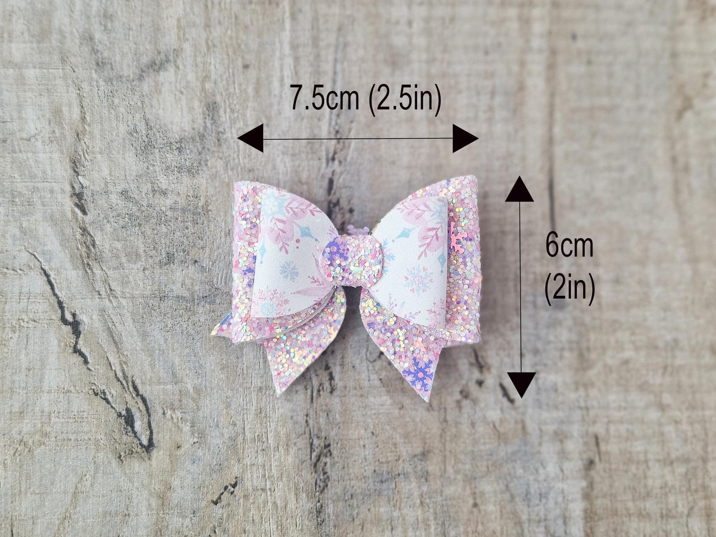 Pink Christmas Glitter Hair Bow in a Snowflake Design For Toddler or Girl.