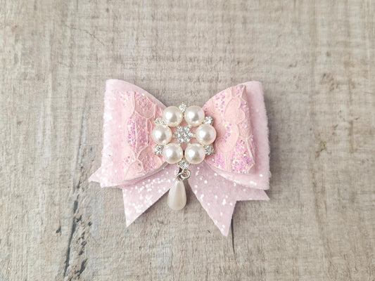 Pink Glitter Hair Bow with a Large Pearl Embellishment.  Ideal for Special Occasions.