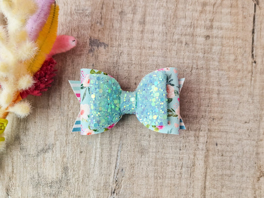 Pastel Green Spring Hair bow with a Floral design and Glitter.