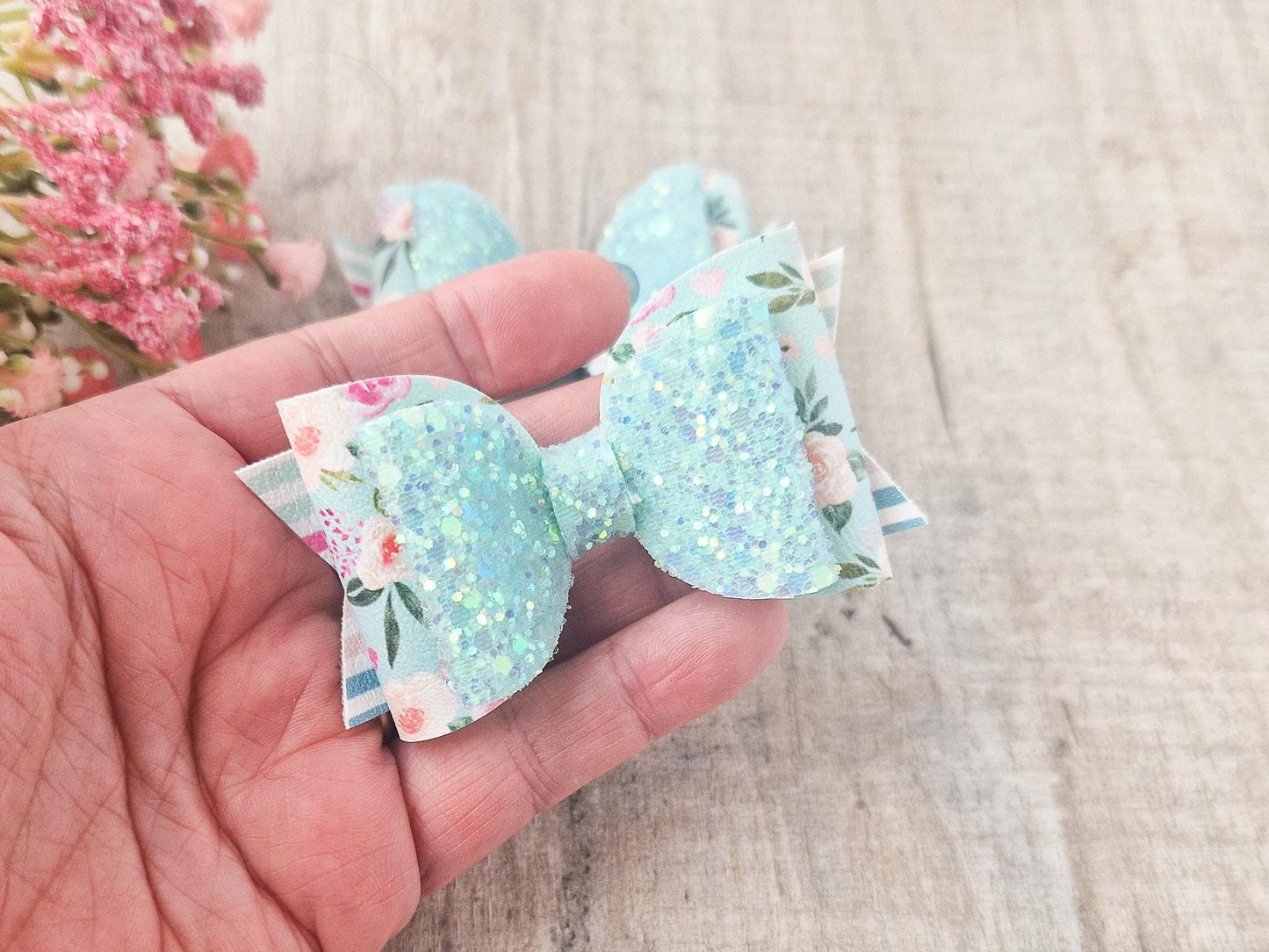 Pastel Green Spring Hair bow with a Floral design and Glitter.