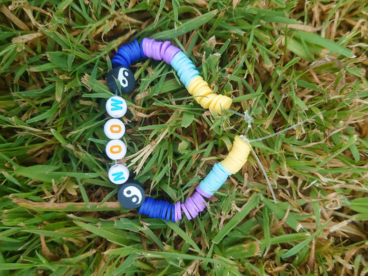 Colorful beaded bracelet on grass