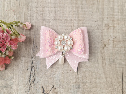 Pink Glitter Hair Bow with a Large Pearl Embellishment.  Ideal for Special Occasions.
