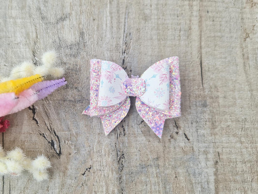 Pink Christmas Glitter Hair Bow in a Snowflake Design For Toddler or Girl.